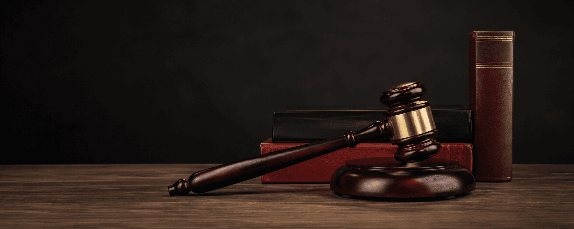 Judge's gavel resting on legal books